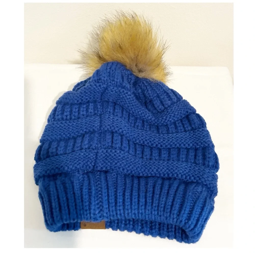 NWOT blue Pompom CC beanie.